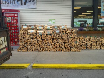 Michigan Fuelwood firewood bundles outside convenience store