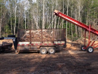 michigan fuelwood products loading wood into trailer