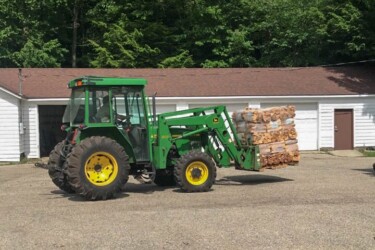Michigan Fuelwood firewood bundle pallet on tractor